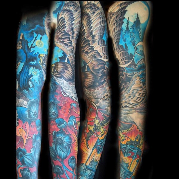 手臂华丽的彩绘飞鹰森林花朵纹身图案
