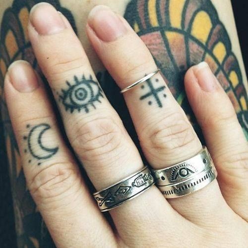 手指月亮眼睛十字架图腾纹身图案