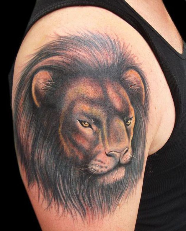 大臂漂亮的狮子头像纹身图案