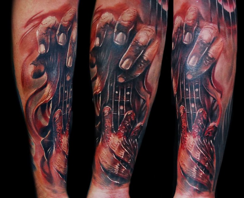 手臂彩色血腥的吉他手纹身图案