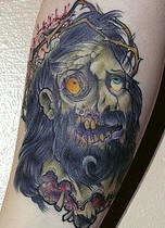 腿部彩色僵尸耶稣头纹身图案
