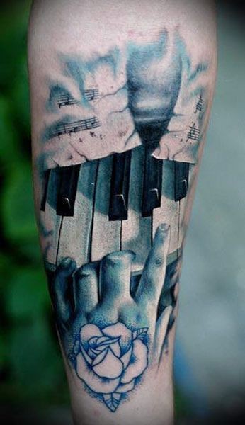 手臂现实主义风格的彩色钢琴键纹身图案