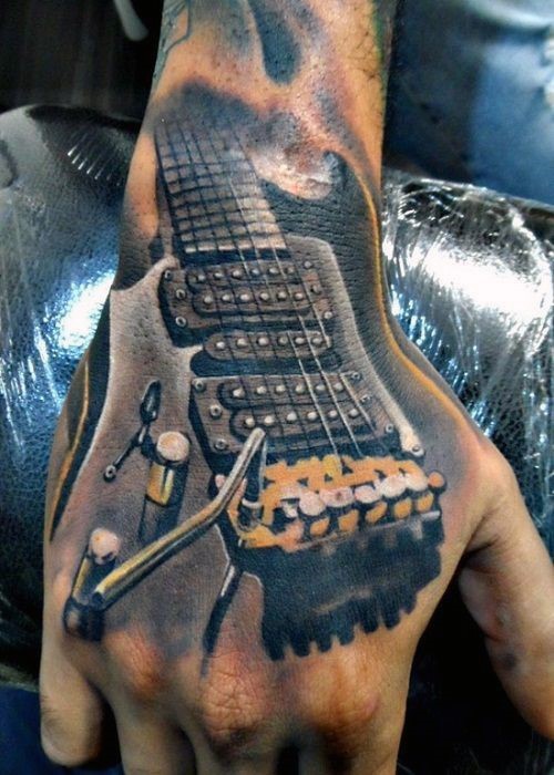 手背逼真的彩色吉他纹身图案