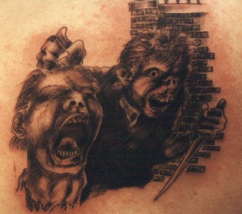 提着人类头的猴子恶魔纹身图案