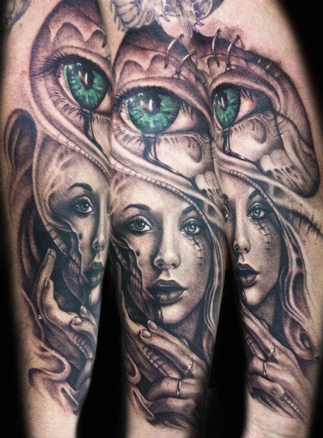 手臂彩绘女性肖像与绿色眼睛纹身图案