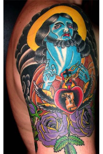肩部超现实色彩的耶稣纹身图案