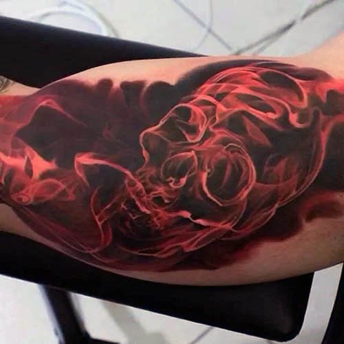 手臂彩色神奇的红色氤氲的骷髅头纹身图案