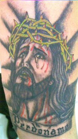 腿部彩色耶稣头像纹身图案
