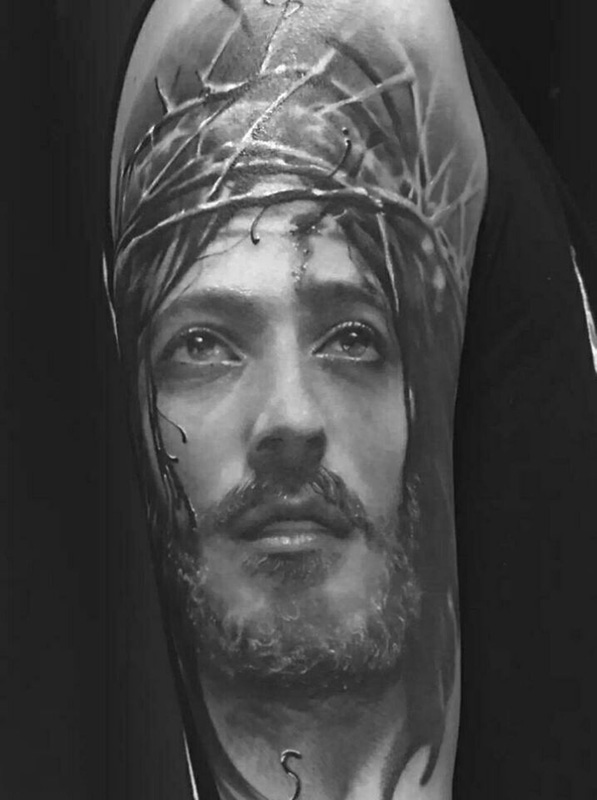 手臂耶稣肖像个性纹身图案