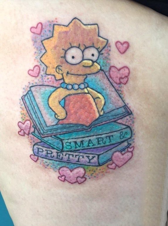 纹身卡通 女生大腿上彩色书籍和卡通纹身图片