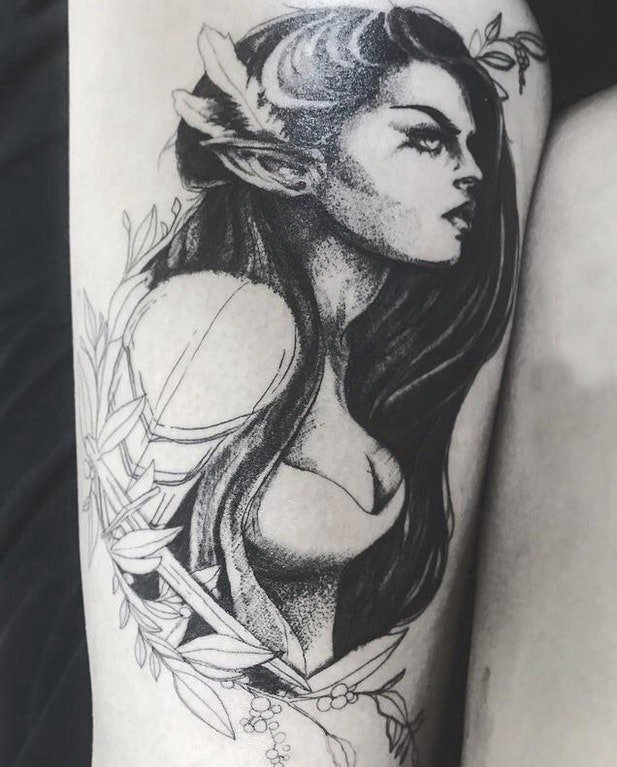 纹身腿部 女生大腿上植物和人物肖像纹身图片
