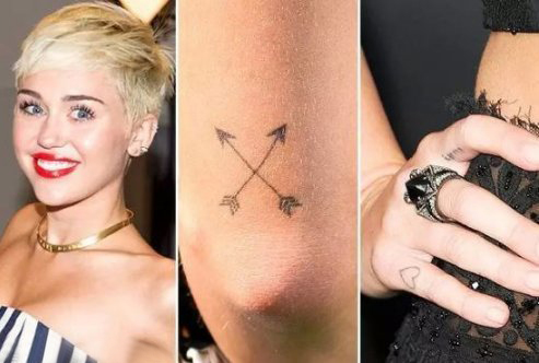 美国纹身明星  Miley Cyrus手臂上黑色的极简纹身图片