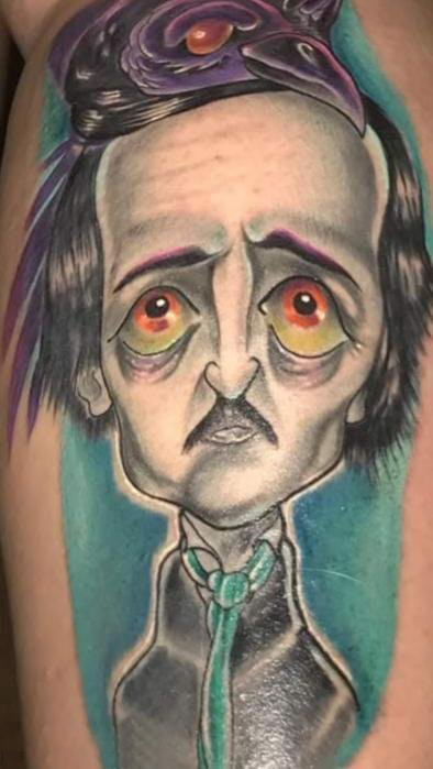 人物肖像纹身  男生手臂上彩绘的卡通人物肖像纹身图片