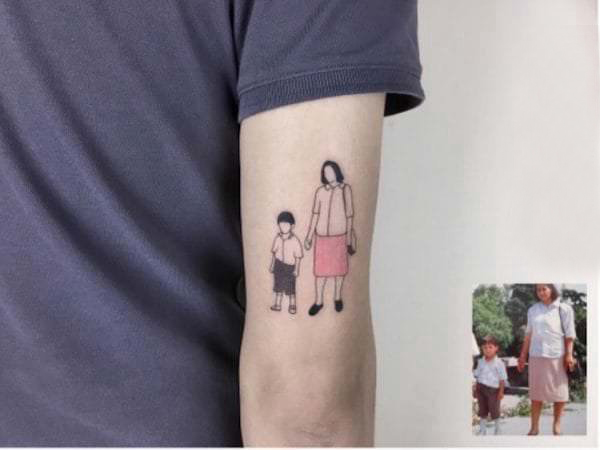 纹身照片 男生手臂上彩色的照片纹身图片