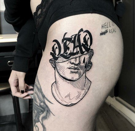 黑灰抽象风格的个性人头纹身图