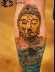 腿部经典的一张佛头铜像纹身图片