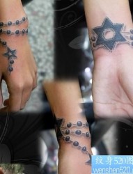 手臂纹身图片：手臂五角星六芒星吊链纹身图片纹身作品