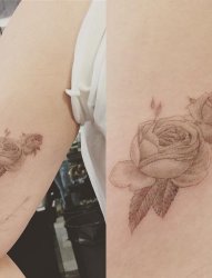 手臂上漂亮的灰色玫瑰花纹身图片