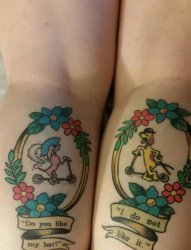 女生腿上彩绘清新花朵与小狗纹身图片