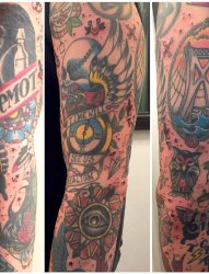 男生手臂上彩绘花臂建筑物与动物纹身个性纹身图片