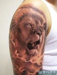 武汉纹身：大臂狮子头纹身
