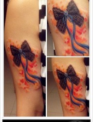 手臂前卫精美的蕾丝蝴蝶结纹身图片