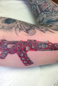 彩色骷髅骨架组成的步枪手臂纹身图案