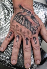 手背3D逼真的黑白生物力学撕皮纹身图案