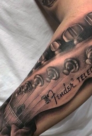 手臂非常逼真的吉他与手字母纹身图案