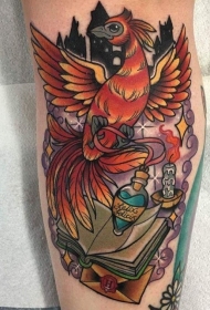手臂彩色的凤凰与魔法药水和书纹身图案