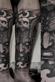 壮观的黑色恶魔人与骷髅手臂纹身图案