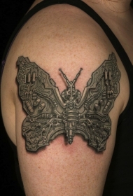 手臂上的个性机械蝴蝶纹身图案
