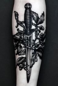 小臂黑色雕刻风格匕首与树叶纹身图案