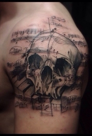 肩部音乐主题黑色骷髅与音符纹身图案