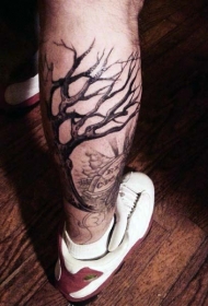 小腿黑色的孤独树与墓地纹身图案