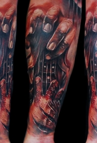 手臂彩色血腥的吉他手纹身图案