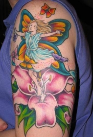 百合花上跳跃的精灵和蝴蝶纹身图案