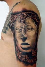 大臂石雕风格很酷的面具纹身图案