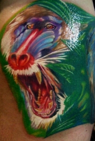 彩绘狒狒在绿色植物中纹身图案