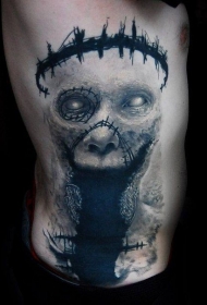 男性腰部恐怖风格彩色怪物脸纹身图案