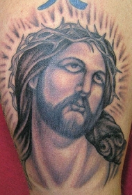 腿部彩色耶稣头像纹身图片