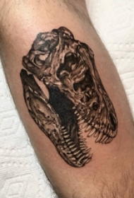 欧美小腿纹身 男生小腿上黑色的恐龙头骨纹身图片