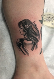 欧美小腿纹身 男生小腿上黑色的卡通人物纹身图片